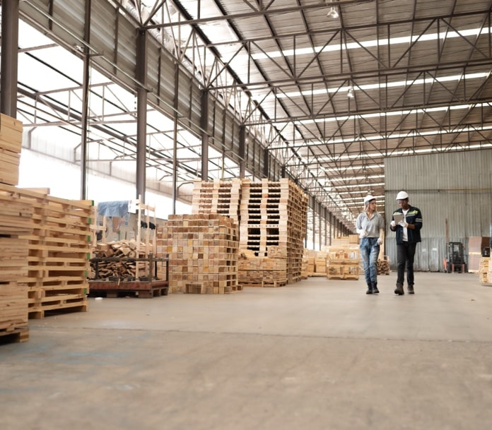 Warehouse filled with pallets, crates and specialty storage products.